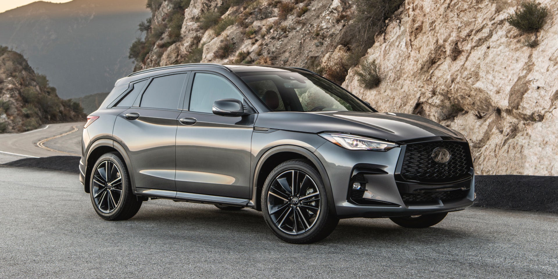 2025-infiniti-qx50-compact-suv-driving-through-mountains-d.jpg